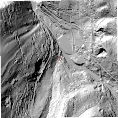 Shaded relief map of the ground around GL179SG, computed from Environment Agency LiDAR. The ground here sits at about 73 m above sea level and falls 130 m across the surrounding 800 m. Surface water reaching this point runs off ground lying to the west, 115.4 m higher.