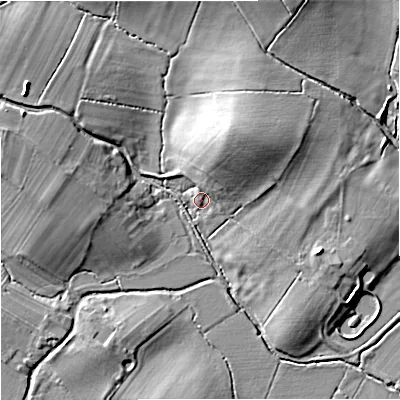 Shaded relief map of the ground around GL194LB, computed from Environment Agency LiDAR. The ground here sits at about 11 m above sea level and falls 10 m across the surrounding 800 m. Surface water reaching this point runs off ground lying to the west-north-west, 9.1 m higher.
