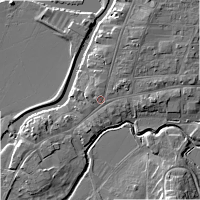 Shaded relief map of the ground around GL205AB, computed from Environment Agency LiDAR. The ground here sits at about 13 m above sea level and falls 11 m across the surrounding 800 m. Surface water reaching this point runs off ground lying to the north-east, 3.2 m higher.