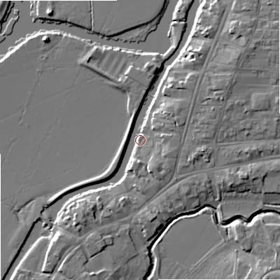 Shaded relief map of the ground around GL205AX, computed from Environment Agency LiDAR. The ground here sits at about 12 m above sea level and falls 8 m across the surrounding 800 m. Surface water reaching this point runs off ground lying to the east-north-east, 5.5 m higher.