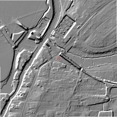 Shaded relief map of the ground around GL205BD, computed from Environment Agency LiDAR. The ground here sits at about 12 m above sea level and falls 9 m across the surrounding 800 m. Surface water reaching this point runs off ground lying to the north-east, 7.1 m higher.