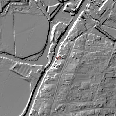 Shaded relief map of the ground around GL205BQ, computed from Environment Agency LiDAR. The ground here sits at about 13 m above sea level and falls 9 m across the surrounding 800 m. Surface water reaching this point runs off ground lying to the east-south-east, 6.9 m higher.