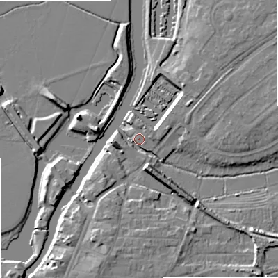Shaded relief map of the ground around GL205BX, computed from Environment Agency LiDAR. The ground here sits at about 12 m above sea level and falls 9 m across the surrounding 800 m. Surface water reaching this point runs off ground lying to the south-south-east, 8.1 m higher.