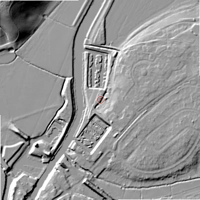 Shaded relief map of the ground around GL205BY, computed from Environment Agency LiDAR. The ground here sits at about 12 m above sea level and falls 22 m across the surrounding 800 m. Surface water reaching this point runs off ground lying to the east, 5.1 m higher.
