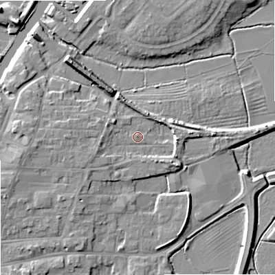 Shaded relief map of the ground around GL205DW, computed from Environment Agency LiDAR. The ground here sits at about 13 m above sea level and falls 9 m across the surrounding 800 m. Surface water reaching this point runs off ground lying to the east, 3.9 m higher.