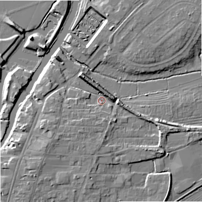Shaded relief map of the ground around GL205DY, computed from Environment Agency LiDAR. The ground here sits at about 12 m above sea level and falls 9 m across the surrounding 800 m. Surface water reaching this point runs off ground lying to the north, 4.6 m higher.