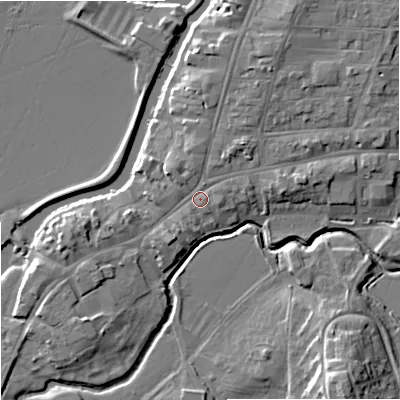 Shaded relief map of the ground around GL205PA, computed from Environment Agency LiDAR. The ground here sits at about 13 m above sea level and falls 12 m across the surrounding 800 m. Surface water reaching this point runs off ground lying to the north-east, 3.3 m higher.
