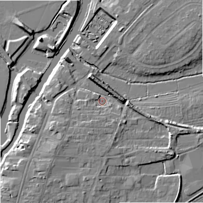 Shaded relief map of the ground around GL205PH, computed from Environment Agency LiDAR. The ground here sits at about 12 m above sea level and falls 9 m across the surrounding 800 m. Surface water reaching this point runs off ground lying to the north-north-east, 6.1 m higher.
