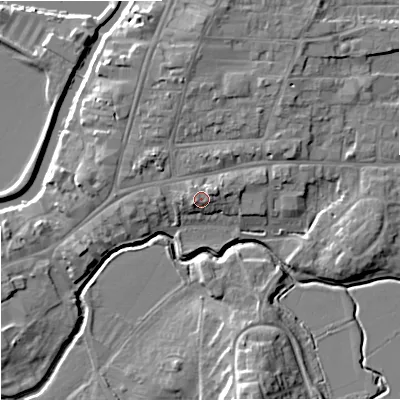 Shaded relief map of the ground around GL205PN, computed from Environment Agency LiDAR. The ground here sits at about 15 m above sea level and falls 12 m across the surrounding 800 m. Surface water reaching this point runs off ground lying to the west-south-west, 1.8 m higher.