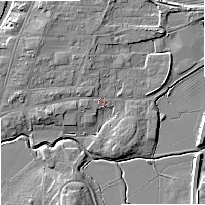 Shaded relief map of the ground around GL205QL, computed from Environment Agency LiDAR. The ground here sits at about 13 m above sea level and falls 9 m across the surrounding 800 m. Surface water reaching this point runs off ground lying to the north-west, 3.7 m higher.