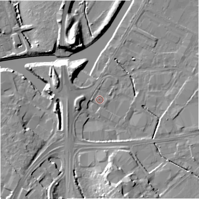 Shaded relief map of the ground around GL25FE, computed from Environment Agency LiDAR. The ground here sits at about 12 m above sea level and falls 14 m across the surrounding 800 m. Surface water reaching this point runs off ground lying to the west, 3.7 m higher.
