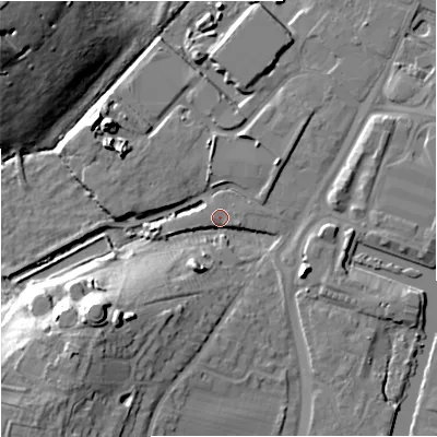 Shaded relief map of the ground around GL25JF, computed from Environment Agency LiDAR. The ground here sits at about 11 m above sea level and falls 22 m across the surrounding 800 m. Surface water reaching this point runs off ground lying to the south-west, 16.3 m higher.