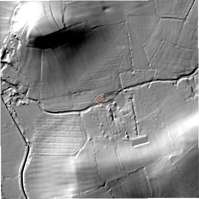 Shaded relief map of the ground around GL28JT, computed from Environment Agency LiDAR. The ground here sits at about 12 m above sea level and falls 34 m across the surrounding 800 m. Surface water reaching this point runs off ground lying to the south, 15.6 m higher.