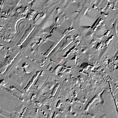 Shaded relief map of the ground around GL501JX, computed from Environment Agency LiDAR. The ground here sits at about 58 m above sea level and falls 14 m across the surrounding 800 m. Surface water reaching this point runs off ground lying to the south, 8.2 m higher.