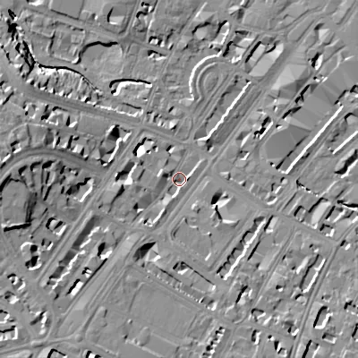 Shaded relief map of the ground around GL501NW, computed from Environment Agency LiDAR. The ground here sits at about 56 m above sea level and falls 21 m across the surrounding 800 m. Surface water reaching this point runs off ground lying to the south-west, 12.5 m higher.