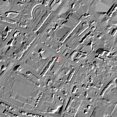 Shaded relief map of the ground around GL501TH, computed from Environment Agency LiDAR. The ground here sits at about 58 m above sea level and falls 16 m across the surrounding 800 m. Surface water reaching this point runs off ground lying to the south, 10.7 m higher.