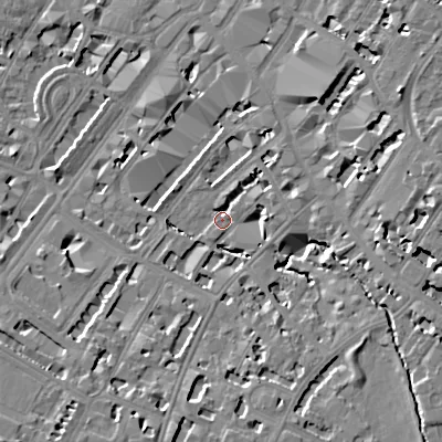 Shaded relief map of the ground around GL501XL, computed from Environment Agency LiDAR. The ground here sits at about 58 m above sea level and falls 13 m across the surrounding 800 m. Surface water reaching this point runs off ground lying to the east-south-east, 8.9 m higher.