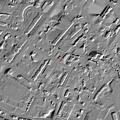 Shaded relief map of the ground around GL501XN, computed from Environment Agency LiDAR. The ground here sits at about 57 m above sea level and falls 16 m across the surrounding 800 m. Surface water reaching this point runs off ground lying to the south, 9.9 m higher.