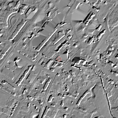 Shaded relief map of the ground around GL501XY, computed from Environment Agency LiDAR. The ground here sits at about 58 m above sea level and falls 13 m across the surrounding 800 m. Surface water reaching this point runs off ground lying to the east-south-east, 9.1 m higher.