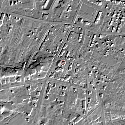 Shaded relief map of the ground around GL502EW, computed from Environment Agency LiDAR. The ground here sits at about 65 m above sea level and falls 16 m across the surrounding 800 m. Surface water reaching this point runs off ground lying to the south-south-east, 9.4 m higher.
