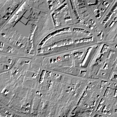 Shaded relief map of the ground around GL502JA, computed from Environment Agency LiDAR. The ground here sits at about 64 m above sea level and falls 15 m across the surrounding 800 m. Surface water reaching this point runs off ground lying to the east-north-east, 5.5 m higher.