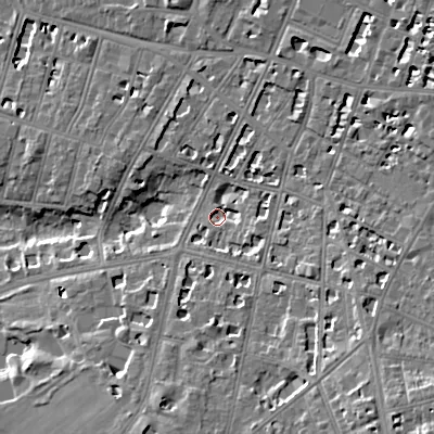 Shaded relief map of the ground around GL502RA, computed from Environment Agency LiDAR. The ground here sits at about 64 m above sea level and falls 17 m across the surrounding 800 m. Surface water reaching this point runs off ground lying to the south-east, 4.9 m higher.