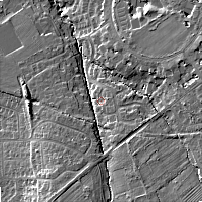 Shaded relief map of the ground around GL502SS, computed from Environment Agency LiDAR. The ground here sits at about 66 m above sea level and falls 18 m across the surrounding 800 m. Surface water reaching this point runs off ground lying to the south-east, 2.8 m higher.