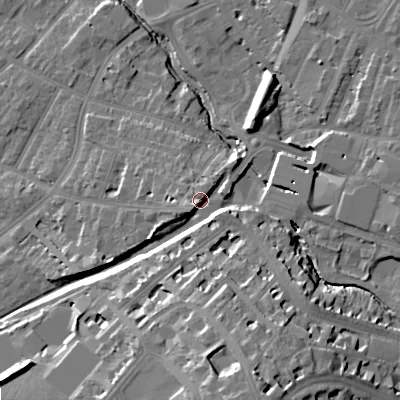 Shaded relief map of the ground around GL503EG, computed from Environment Agency LiDAR. The ground here sits at about 58 m above sea level and falls 26 m across the surrounding 800 m. Surface water reaching this point runs off ground lying to the south-west, 5.9 m higher.