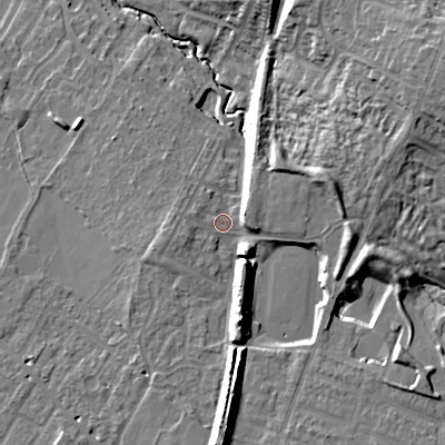 Shaded relief map of the ground around GL504GB, computed from Environment Agency LiDAR. The ground here sits at about 50 m above sea level and falls 21 m across the surrounding 800 m. Surface water reaching this point runs off ground lying to the east-north-east, 12.3 m higher.