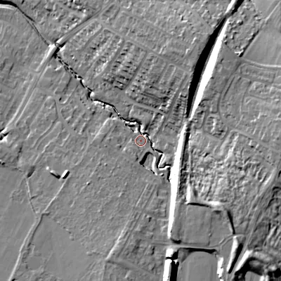 Shaded relief map of the ground around GL504GP, computed from Environment Agency LiDAR. The ground here sits at about 45 m above sea level and falls 23 m across the surrounding 800 m. Surface water reaching this point runs off ground lying to the east, 19.4 m higher.