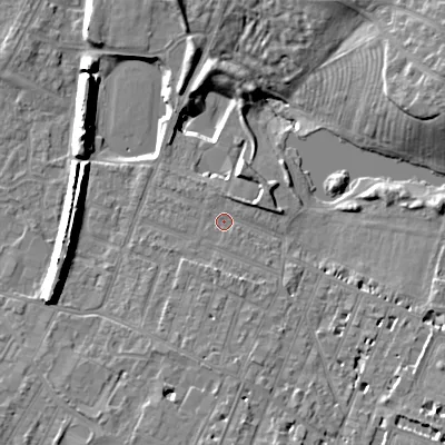 Shaded relief map of the ground around GL504HF, computed from Environment Agency LiDAR. The ground here sits at about 53 m above sea level and falls 14 m across the surrounding 800 m. Surface water reaching this point runs off ground lying to the south, 0.6 m higher.