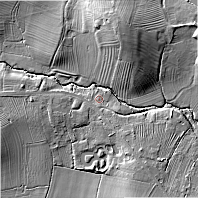 Shaded relief map of the ground around GL510TE, computed from Environment Agency LiDAR. The ground here sits at about 29 m above sea level and falls 16 m across the surrounding 800 m. Surface water reaching this point runs off ground lying to the south-east, 4.2 m higher.