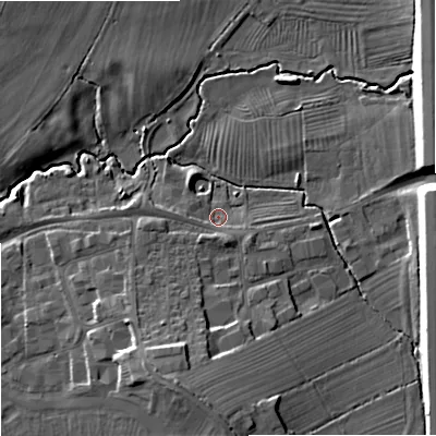 Shaded relief map of the ground around GL510TF, computed from Environment Agency LiDAR. The ground here sits at about 24 m above sea level and falls 14 m across the surrounding 800 m. Surface water reaching this point runs off ground lying to the south-south-east, 3.3 m higher.