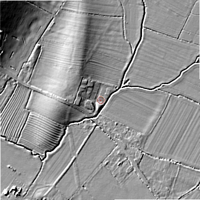 Shaded relief map of the ground around GL519TA, computed from Environment Agency LiDAR. The ground here sits at about 18 m above sea level and falls 13 m across the surrounding 800 m. Surface water reaching this point runs off ground lying to the west, 5.3 m higher.