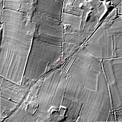 Shaded relief map of the ground around GL519TH, computed from Environment Agency LiDAR. The ground here sits at about 28 m above sea level and falls 17 m across the surrounding 800 m. Surface water reaching this point runs off ground lying to the south, 12.5 m higher.