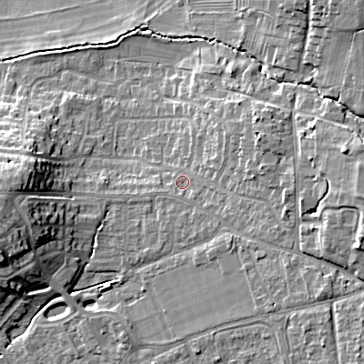 Shaded relief map of the ground around GL523EE, computed from Environment Agency LiDAR. The ground here sits at about 67 m above sea level and falls 18 m across the surrounding 800 m. Surface water reaching this point runs off ground lying to the east-south-east, 9.8 m higher.