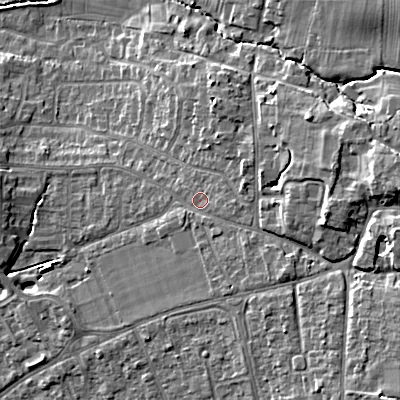Shaded relief map of the ground around GL523LR, computed from Environment Agency LiDAR. The ground here sits at about 70 m above sea level and falls 17 m across the surrounding 800 m. Surface water reaching this point runs off ground lying to the east, 9.4 m higher.