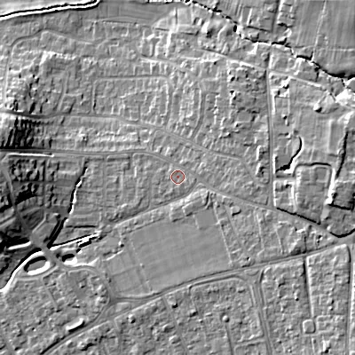 Shaded relief map of the ground around GL523LU, computed from Environment Agency LiDAR. The ground here sits at about 69 m above sea level and falls 17 m across the surrounding 800 m. Surface water reaching this point runs off ground lying to the east-south-east, 0.9 m higher.