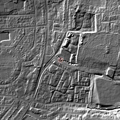 Shaded relief map of the ground around GL525JR, computed from Environment Agency LiDAR. The ground here sits at about 74 m above sea level and falls 24 m across the surrounding 800 m. Surface water reaching this point runs off ground lying to the east, 13.9 m higher.
