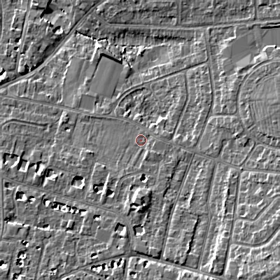 Shaded relief map of the ground around GL525LU, computed from Environment Agency LiDAR. The ground here sits at about 62 m above sea level and falls 13 m across the surrounding 800 m. Surface water reaching this point runs off ground lying to the south-east, 8.0 m higher.
