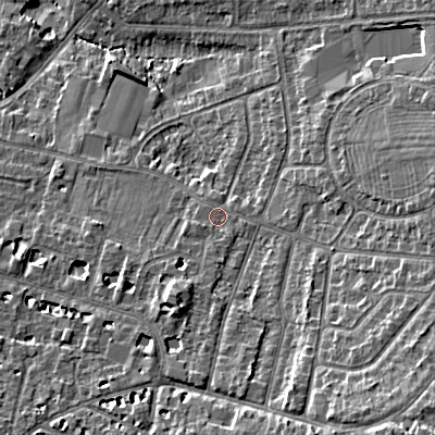 Shaded relief map of the ground around GL525NE, computed from Environment Agency LiDAR. The ground here sits at about 63 m above sea level and falls 15 m across the surrounding 800 m. Surface water reaching this point runs off ground lying to the south-east, 8.7 m higher.