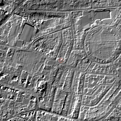 Shaded relief map of the ground around GL525NG, computed from Environment Agency LiDAR. The ground here sits at about 63 m above sea level and falls 14 m across the surrounding 800 m. Surface water reaching this point runs off ground lying to the south, 0.6 m higher.