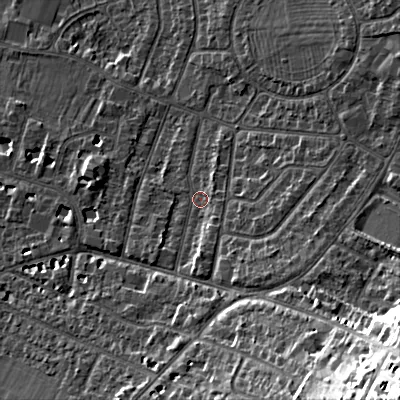 Shaded relief map of the ground around GL525NW, computed from Environment Agency LiDAR. The ground here sits at about 65 m above sea level and falls 36 m across the surrounding 800 m. Surface water reaching this point runs off ground lying to the south-east, 24.3 m higher.