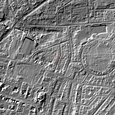 Shaded relief map of the ground around GL525PT, computed from Environment Agency LiDAR. The ground here sits at about 62 m above sea level and falls 13 m across the surrounding 800 m. Surface water reaching this point runs off ground lying to the east, 6.7 m higher.