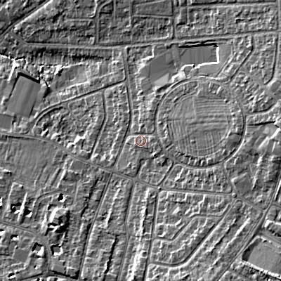 Shaded relief map of the ground around GL525QB, computed from Environment Agency LiDAR. The ground here sits at about 64 m above sea level and falls 15 m across the surrounding 800 m. Surface water reaching this point runs off ground lying to the east, 7.9 m higher.