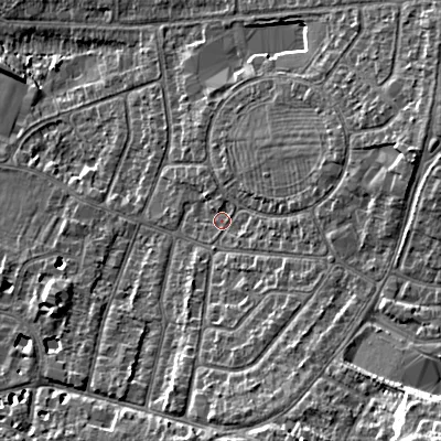 Shaded relief map of the ground around GL525QE, computed from Environment Agency LiDAR. The ground here sits at about 64 m above sea level and falls 20 m across the surrounding 800 m. Surface water reaching this point runs off ground lying to the east-north-east, 7.9 m higher.