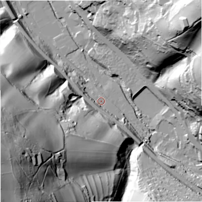 Shaded relief map of the ground around GL52SU, computed from Environment Agency LiDAR. The ground here sits at about 57 m above sea level and falls 111 m across the surrounding 800 m. Surface water reaching this point runs off ground lying to the south, 7.2 m higher.