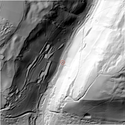 Shaded relief map of the ground around GL52UN, computed from Environment Agency LiDAR. The ground here sits at about 74 m above sea level and falls 136 m across the surrounding 800 m. Surface water reaching this point runs off ground lying to the north-west, 128.4 m higher.