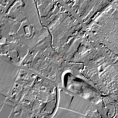 Shaded relief map of the ground around GL537QB, computed from Environment Agency LiDAR. The ground here sits at about 64 m above sea level and falls 17 m across the surrounding 800 m. Surface water reaching this point runs off ground lying to the east-south-east, 12.2 m higher.