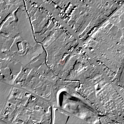 Shaded relief map of the ground around GL537QE, computed from Environment Agency LiDAR. The ground here sits at about 65 m above sea level and falls 17 m across the surrounding 800 m. Surface water reaching this point runs off ground lying to the east, 5.7 m higher.